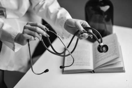 A stethoscope in the hands of the doctorの写真素材