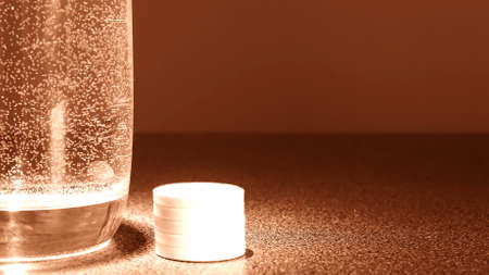 The water in the glass and the medicine on the table. Transparenの写真素材