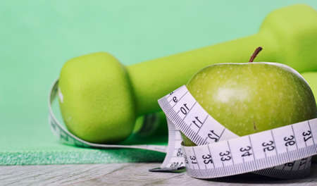 Fitness accessories. Sports dumbbells sneakers sports shoes andの写真素材