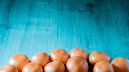 A composition of fresh mandarins on the tableの写真素材