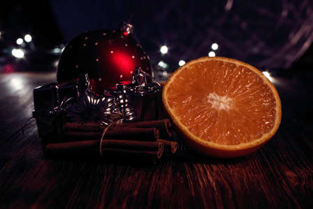 With orange Christmas ball and cinnamon.の写真素材