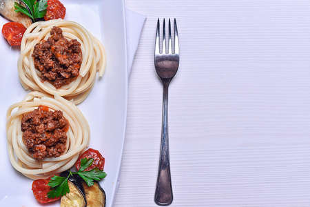 Italian pasta with meat in a cafe. Dinner in the restaurant. Pasの写真素材