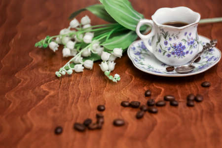Coffee Cup on a napkin at home.The drink on table. Coffee beansの写真素材