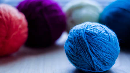 Balls of woolen yarn for knitting on the table. Warm clothes madの写真素材