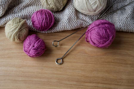 Balls of woolen yarn for knitting on the table. Warm clothes madの写真素材