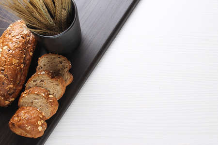Fresh baked bread with ears of wheat. Wheat yellow. Breakfast isの写真素材