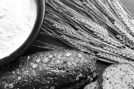 Fresh baked bread with ears of wheat. Wheat yellow. Breakfast isの写真素材