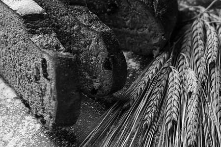 Fresh baked bread with ears of wheat. Wheat yellow. Breakfast isの写真素材