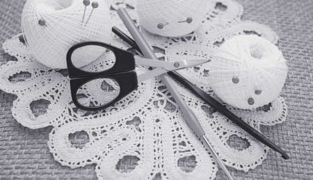 Objects for sewing. Scissors and pins. Hanks thread on mat. Pinsの写真素材