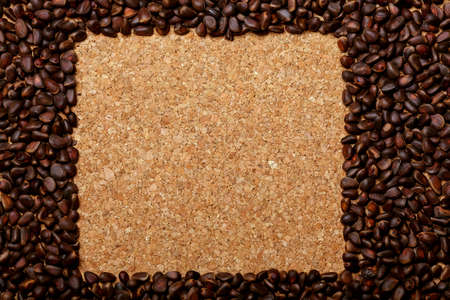 Nuts lying on the table by the handful.Tasty treats on a woodenの写真素材