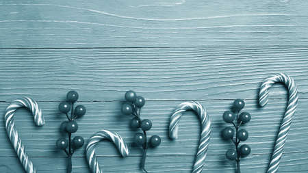 Christmas candy and treats on the table monochrome blue poster.の写真素材