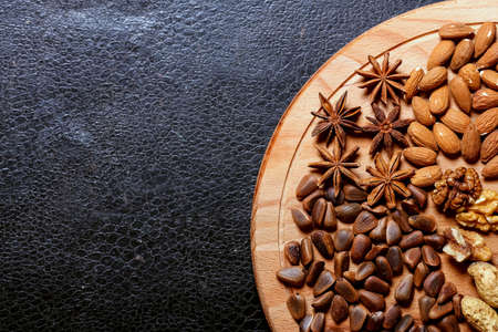 Nuts lying on the table by the handful.の写真素材
