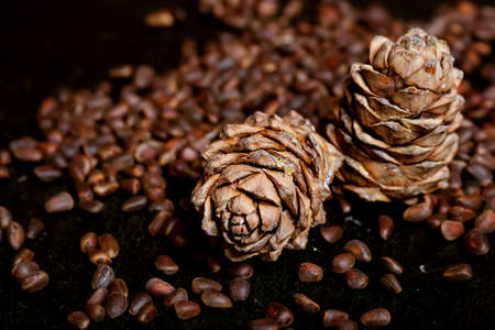 Nuts lying on the table by the handful.Tasty treats on a woodenの写真素材