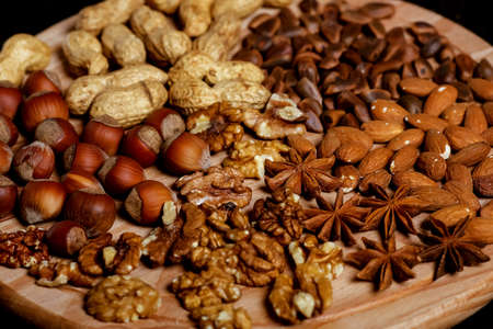 Nuts lying on the table by the handful.