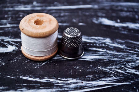 The spool of thread on the table. Thread on a reel for craft. Maの写真素材