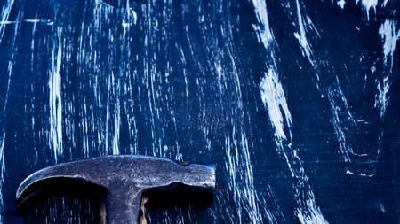 Hammer to repair lying on a wooden table. Mens housework. Workiの写真素材