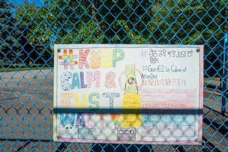 The inscription on the metal fence on the playground.の写真素材