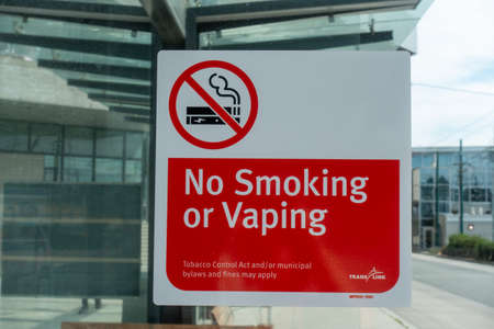 No smoking or vaping sign on the wall of a modern office buildingの写真素材