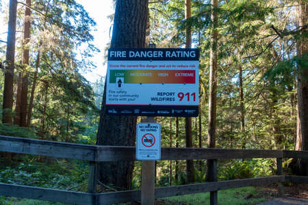 A sign warning people to stay at the entrance to the forest.
