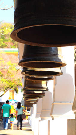 Old bells in a buddhist temple of Thailandの写真素材