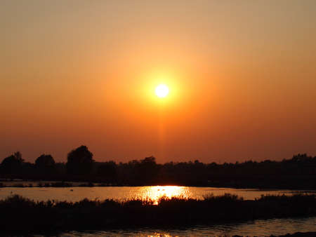 Stock Photo - Beautiful sunset above the river in Thailandの写真素材