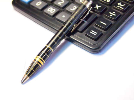 Calculator and pen isolated on white backgroundの写真素材