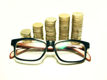 Money concept going up and Glasses isolated on white background         の写真素材