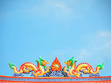 Dragon sculpture on blue skyの写真素材