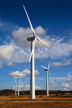 landscape with wind towers and cloudy skyの写真素材