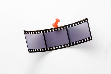 Film with red pin on a white backgroundの写真素材