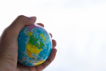 World map in a man handの写真素材