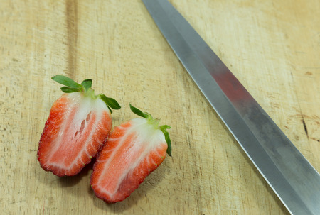 Fresh strawberries and knife photo.の写真素材