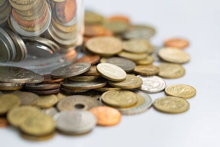 Internaltional coins money saving in bottle