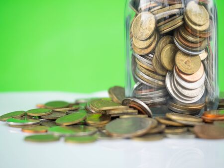 Internaltional coins money saving in bottle