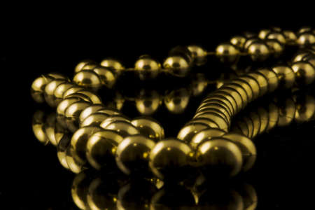yellow beads on black backgroundの写真素材