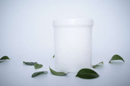 white cosmetic containers with white background
