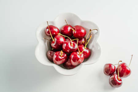fresh cherry fruit on white backgroundの写真素材