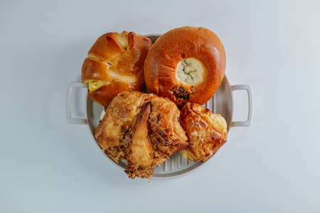 Delicious brownish bread snacks on a gray plate