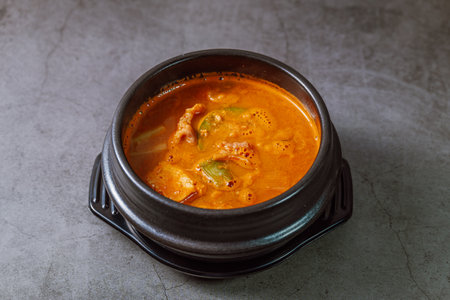 Cheonggukjang, Korean style rich soybean paste stew : A stew made with a thick soybean paste called cheonggukjang (similar to Japanese natto) with dubu (soybean curd / tofu), fully fermented kimchi, and pork. This paste is thicker and has a stronger smell than the regular soybean paste (doenjang). Also called dambukjang-jjigae.の写真素材