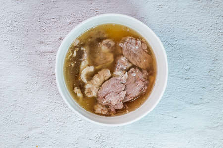 Galbitang, Korean style beef Short Rib Soup : Beef ribs, soaked in cold water to remove the blood, and white radish chunks simmered together until tender. The clear stock is rich and savory, and the tender meat falls off the bone. (Glass noodles may be added.)の写真素材