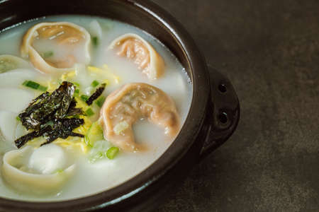tteok mandu guk, Korean style dumpling soup with sliced rice cakeの写真素材
