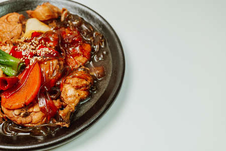 Andongjjimdak, Korean Braised Chicken : To make this dish, chicken is cut into pieces and braised with carrot, potato, and other vegetables, along with a soy sauce-based seasoning. Glass noodles can be added according to one's taste.の写真素材
