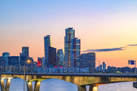 Cityscape of Yeouido skyscrapers in the business financial district taken in the evening sunset time in Seoul, South Koreaの写真素材