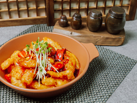 Spicy sweet and sour pork dish served on a plateの写真素材