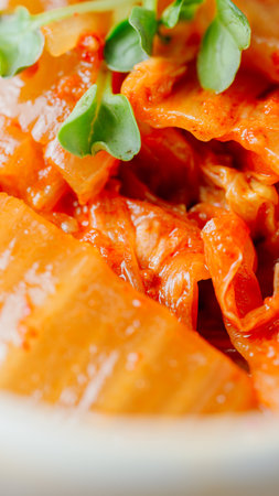 Well-fermented kimchi stir-fried with chopped green onion and garlic in a pan greased with oil, this is a popular side dish usually eaten with rice. It also goes well with bean curd.の写真素材
