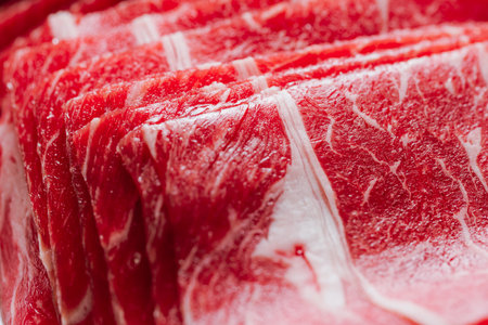 Sliced ââred beef sirloin raw meat ingredients placed on the tableの写真素材