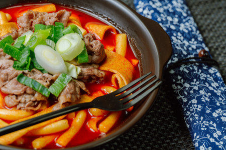 Tteokbokki, Stir-fried Rice Cake : Sliced rice cake bar (garaetteok) or thin rice cake sticks (Tteokbokkitteok) stir-fried in a spicy gochujang sauce with vegetables and fish cakes.の写真素材