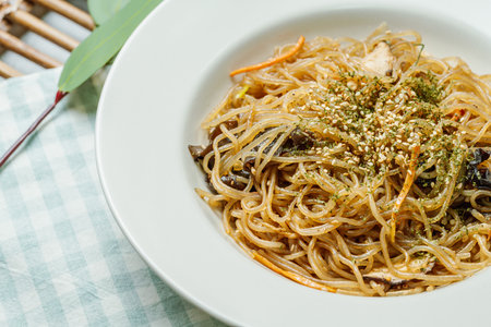 Japchae, Korean Style Stir-fried Glass Noodles and Vegetablesの写真素材