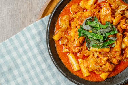 Dakgalbi, korean style Spicy Stir-fried Chicken with rice cake, Chicken pieces marinated in a gochujang, and stir-fried in a flat grill pan with cabbage, sweet potato, carrots, and tteok (rice cakes). A local dish of Chuncheon city in Gangwon Province.の写真素材
