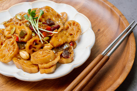 korean food yeongeunjorim, Braised Lotus Roots, Yeongeun (lotus root) parboiled and braised in a mixture of soy sauce and sugar over lower heat. Add syrup and braise to a glaze before serving.の写真素材